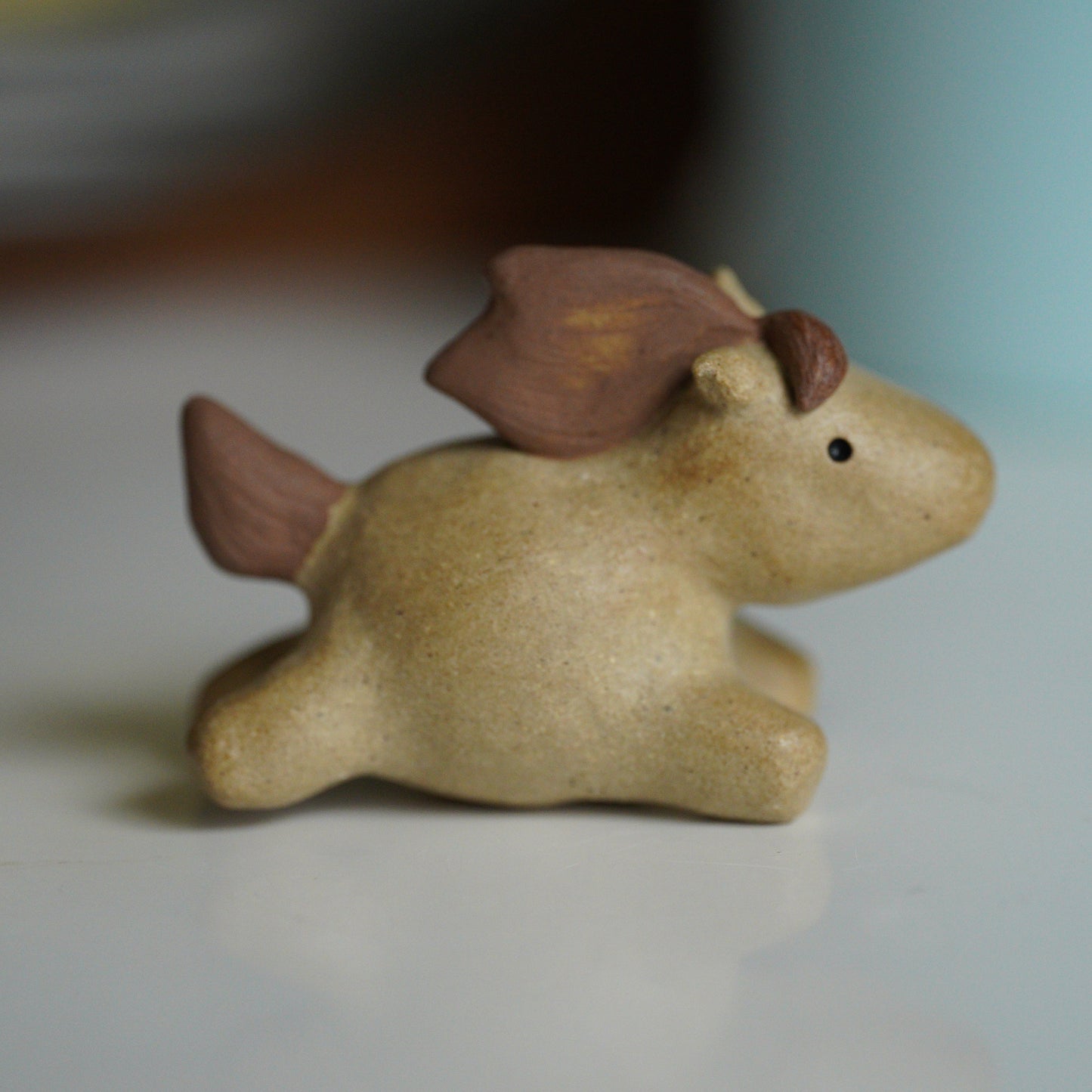 small ceramic horse on blurred background